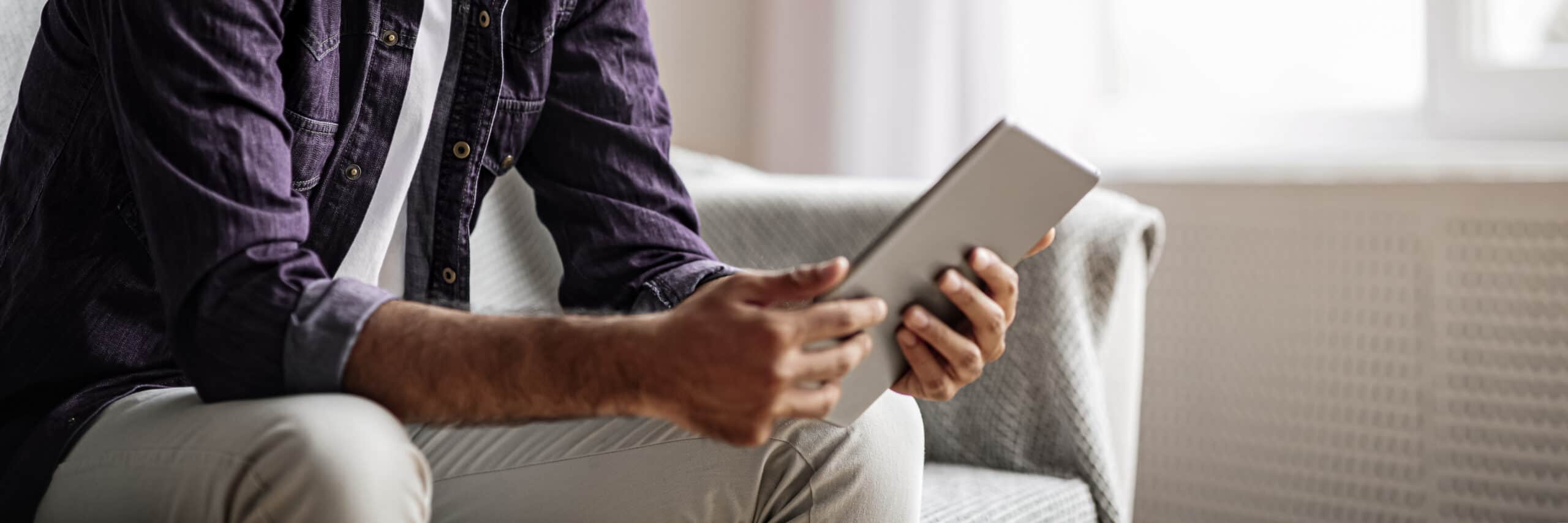 Businessman reading blog on tablet